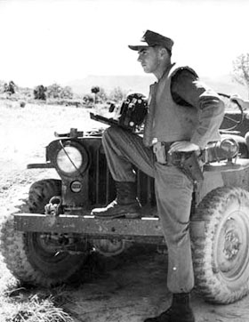 Cpl. Dave Hugel with his 4 x 5 Speed Graphic camera, covering Marine Corps helicopter operations in Vietnam’s “I” Corps during 1963.