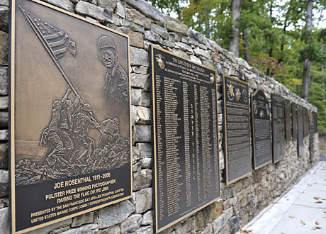 A bronze plaque, sponsered by the San Francisco Bay Area Joe Rosenthal Chapter and members of the U.S. Marine Corps Combat Correspondents Association, is on display after the dedication ceremony recognizing the achievements of former Associated Press photographer, Joe Rosenthal. The ceremony was held on the 102nd anniversary of his birth, at the Semper Fidelis Memorial Chapel, National Museum of the Marine Corps, Triangle, Va., Oct. 9, 2013.  Rosenthal had a long career as a news photographer but his most iconic image was that of the flag raising when the Marines took Iwo Jima during World War II on Feb. 23, 1945, earning him a Pulitzer Prize. (U.S. Marine Corps photo by Kathy Reesey/Released)